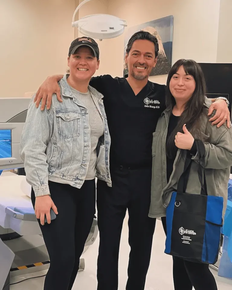 Dr. Carlos Montoya with two happy patients